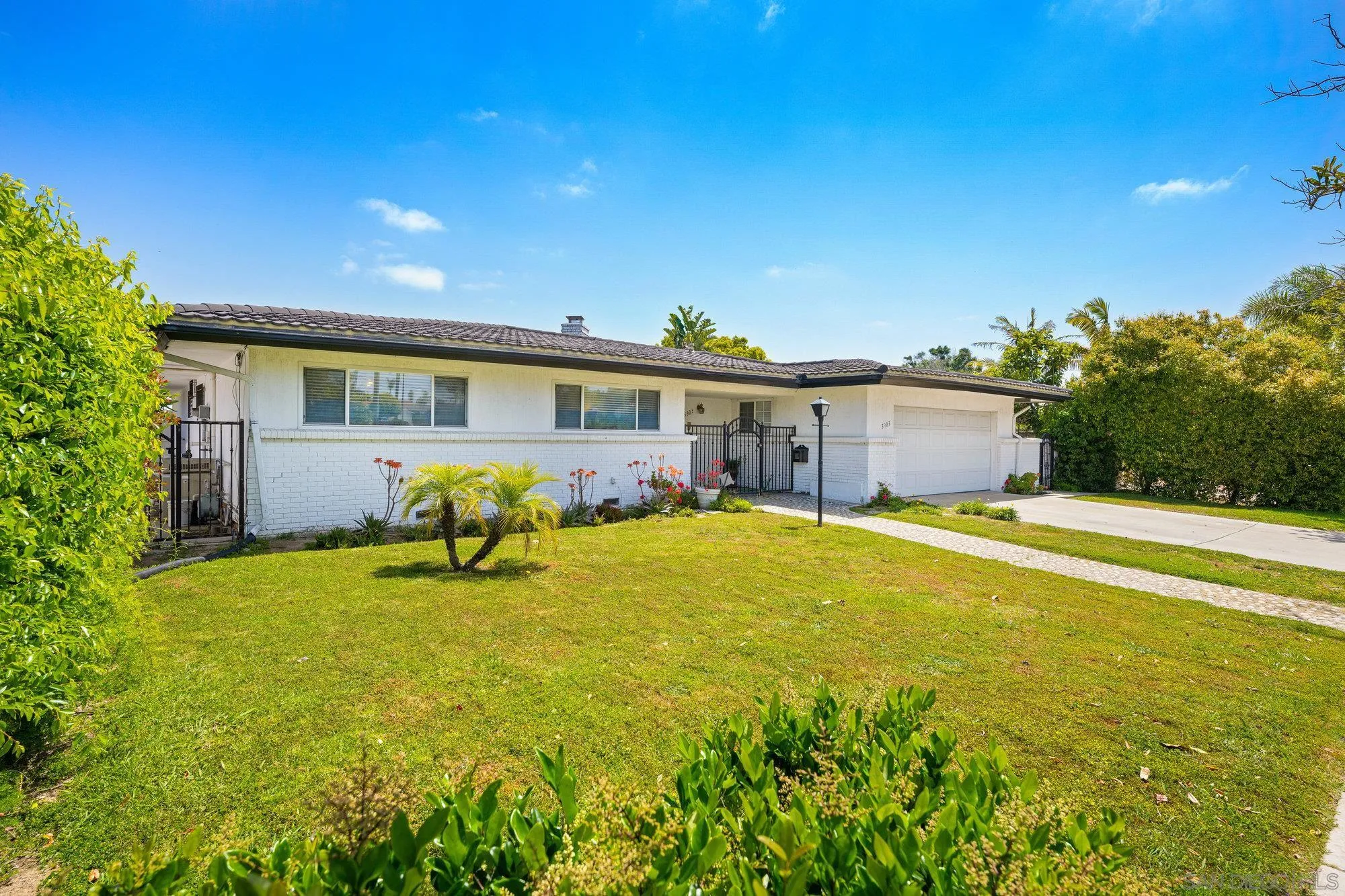 5903 Soledad Mountain Road La Jolla, CA 92037 - Photo 6 of 44 a swimming pool with outdoor seating and yard