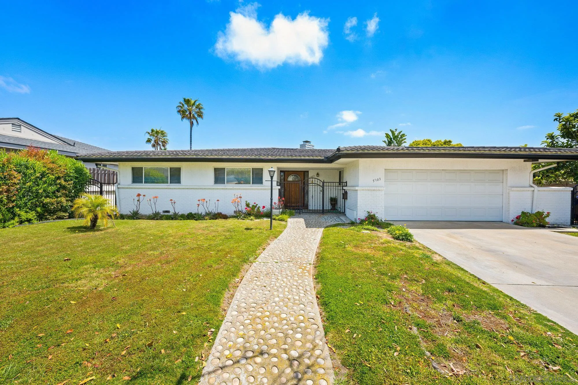 5903 Soledad Mountain Road La Jolla, CA 92037 - Photo 8 of 44 a view of a house with a yard