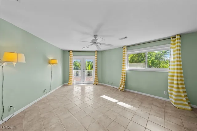 a view of a livingroom with an empty space and a window
