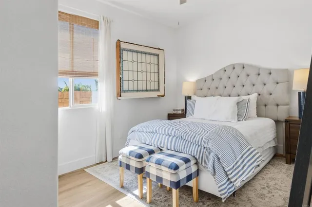 a bedroom with a bed and window