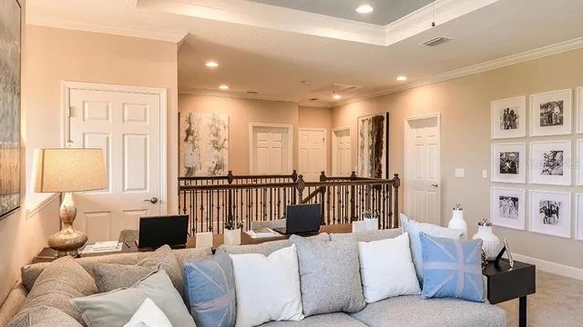 a living room with furniture and a lamp