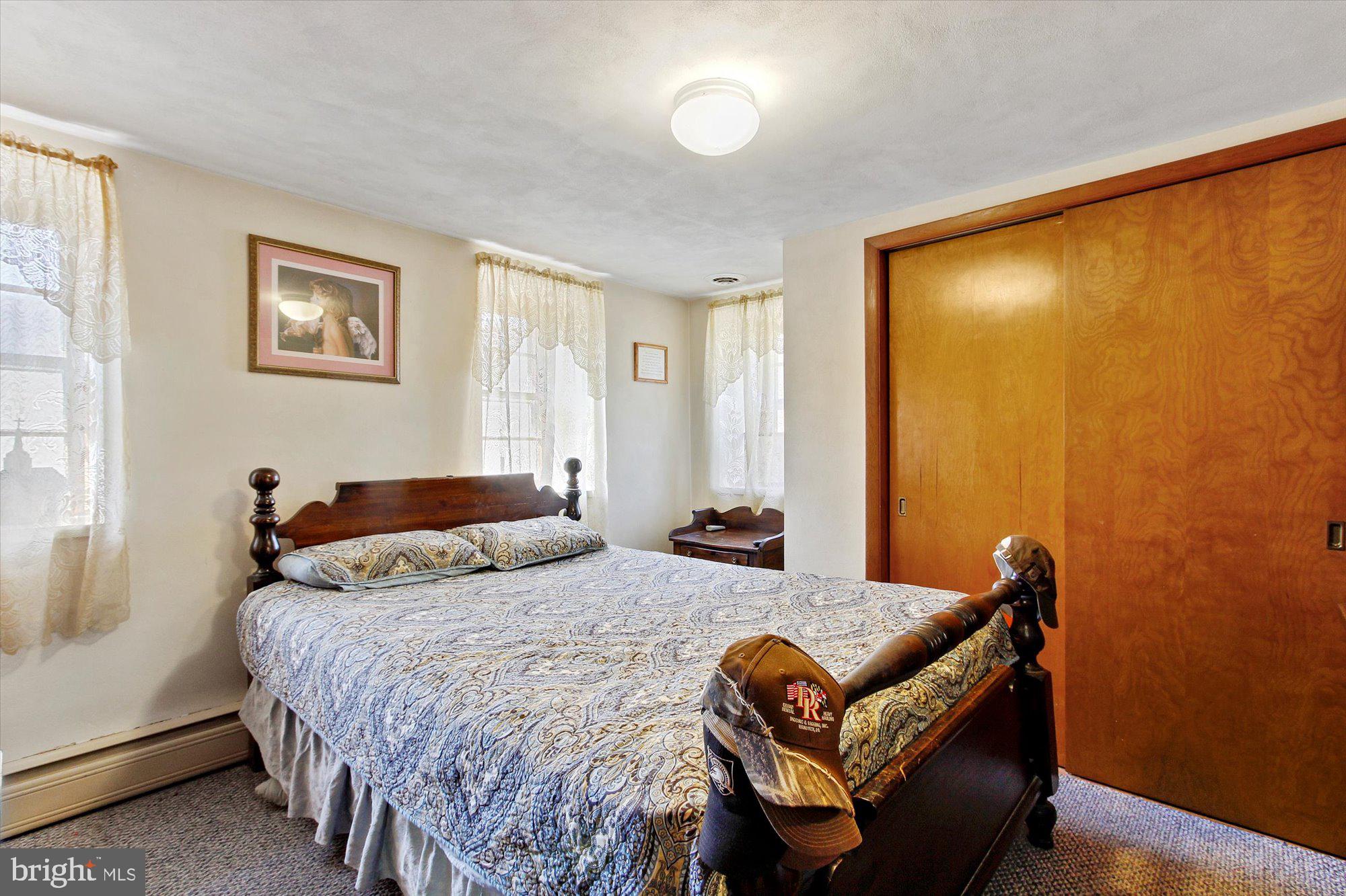 763 Rockville Road Spring Grove, PA 17362 - Photo 15 of 37 a bedroom with a bed and wooden floor