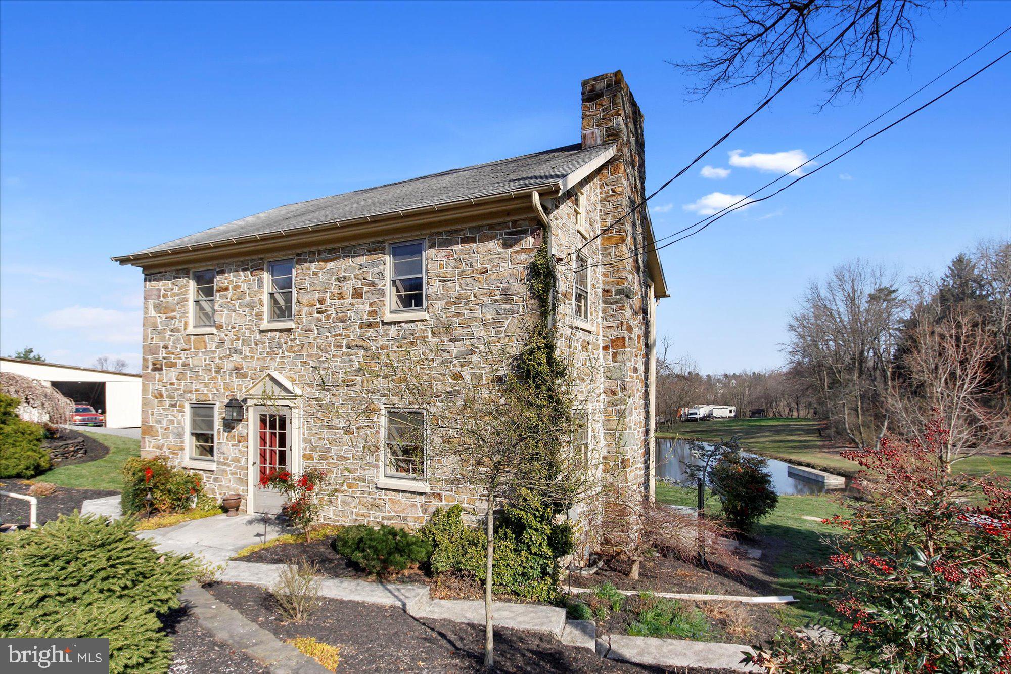 763 Rockville Road Spring Grove, PA 17362 - Photo 3 of 37 a front view of a house with a garden