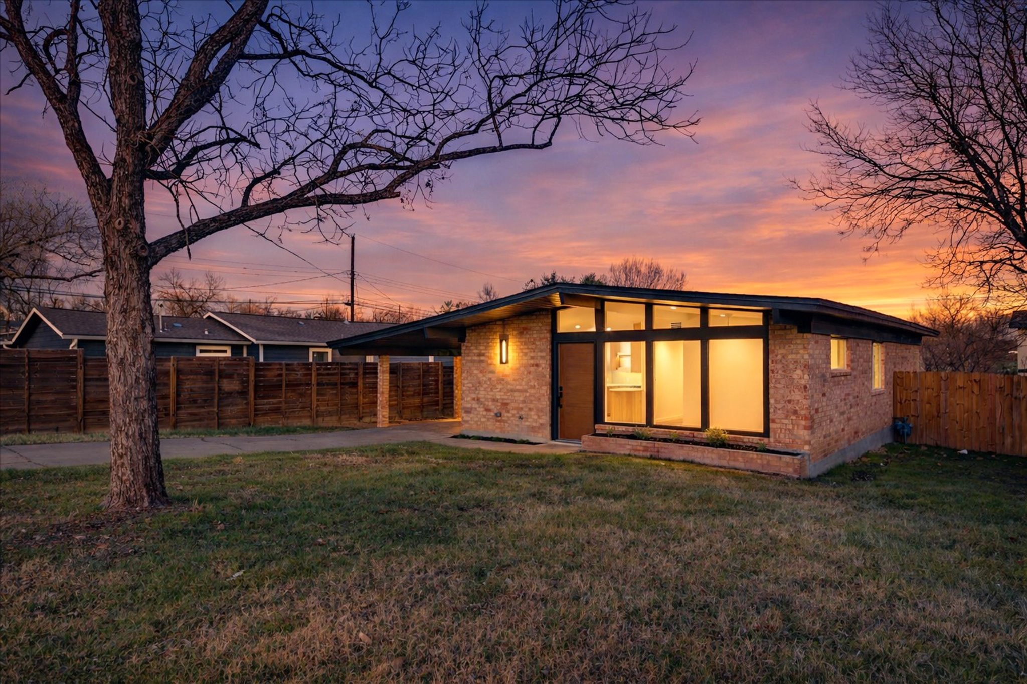 1719 Meander Drive Austin, TX 78721 - Photo 1 of 29 a front view of a house with a yard
