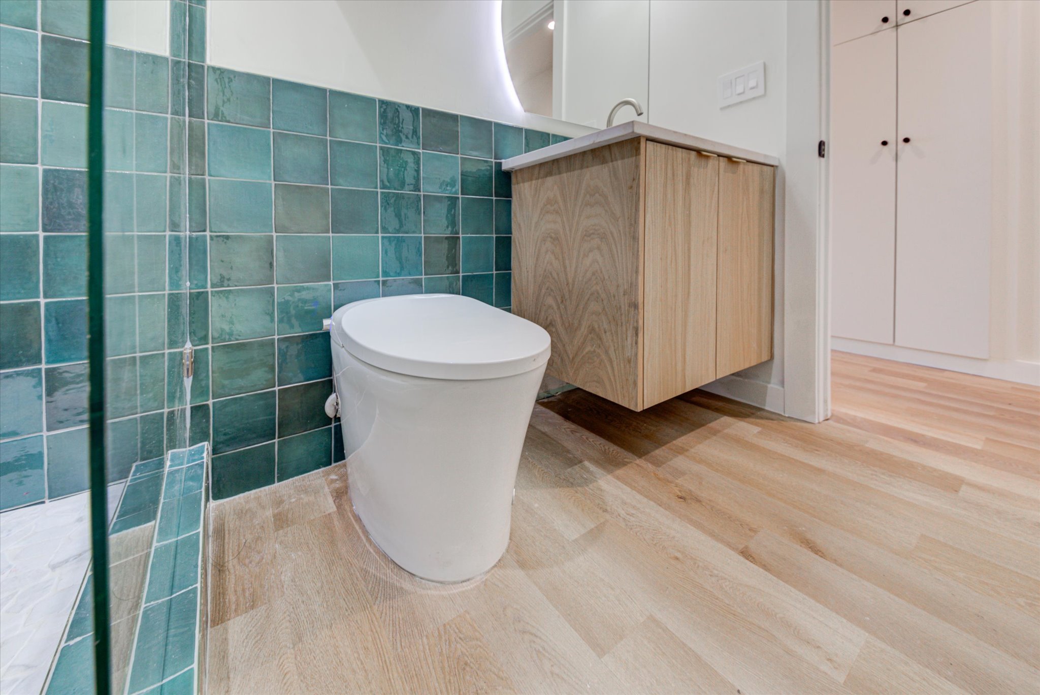 1719 Meander Drive Austin, TX 78721 - Photo 12 of 29 a bathroom with a toilet and a shower