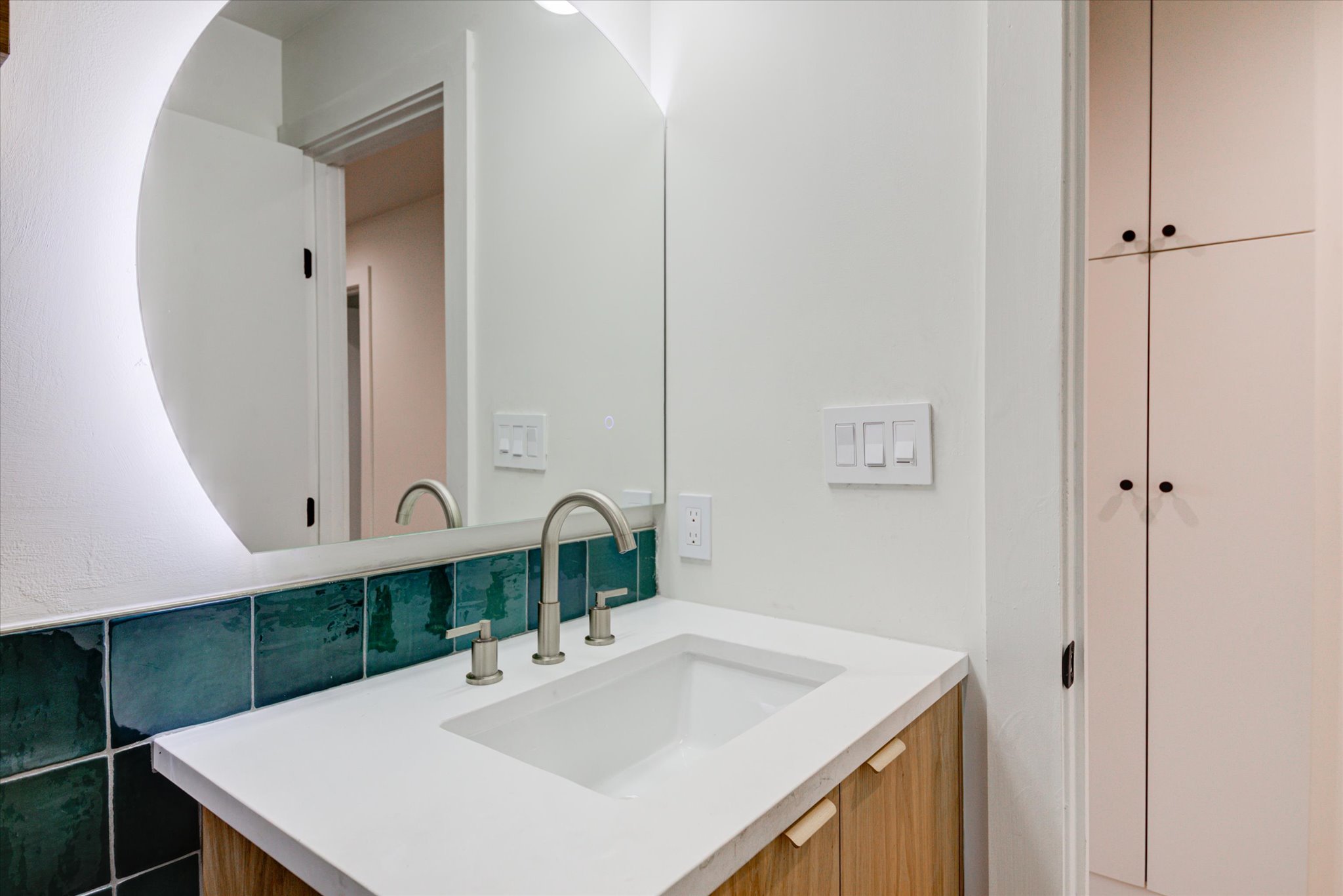 1719 Meander Drive Austin, TX 78721 - Photo 13 of 29 a bathroom with a sink vanity and a mirror