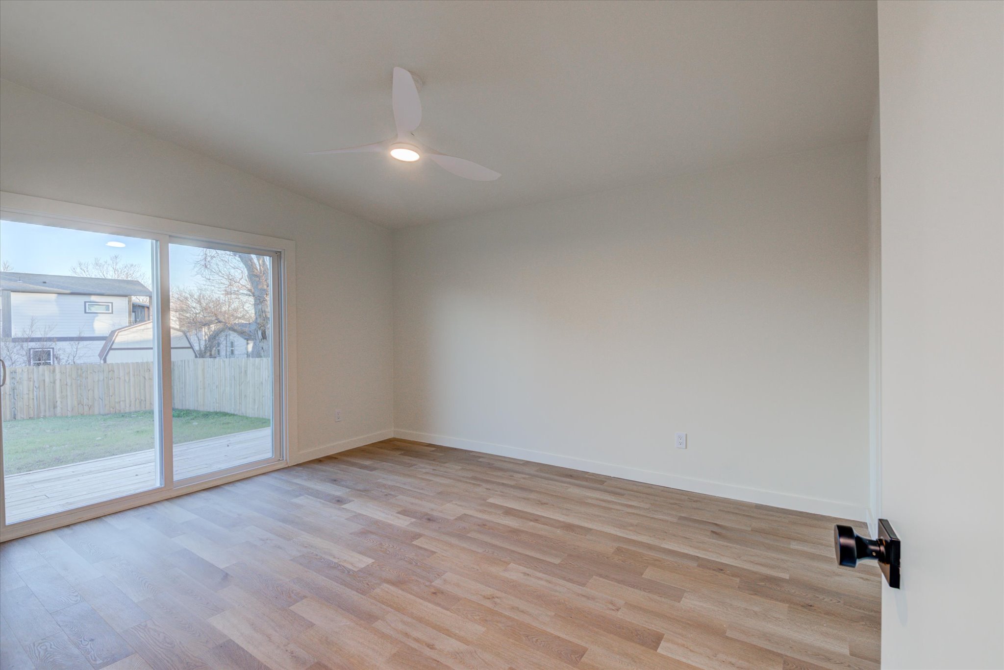 1719 Meander Drive Austin, TX 78721 - Photo 15 of 29 wooden floor in an empty room with a window