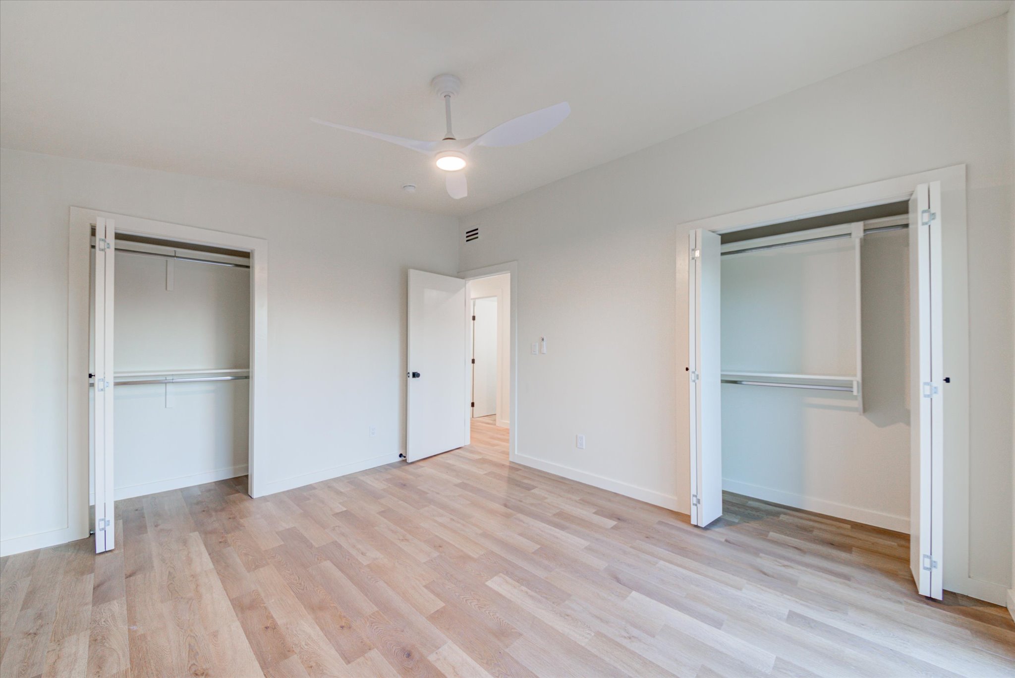 1719 Meander Drive Austin, TX 78721 - Photo 17 of 29 a view of empty room with wooden floor
