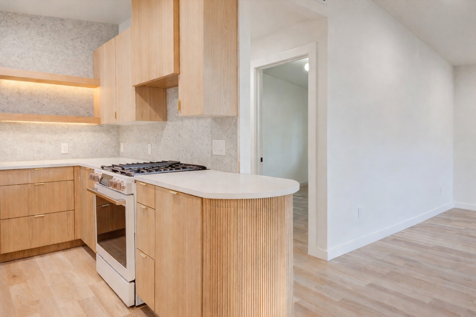 1719 Meander Drive Austin, TX 78721 - Photo 24 of 29 a kitchen with a white stove top oven and sink
