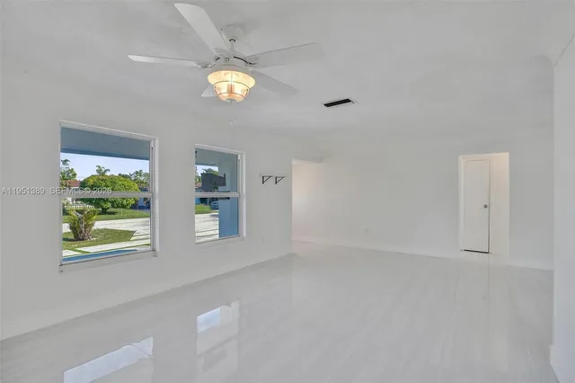 a view of an empty room with a window