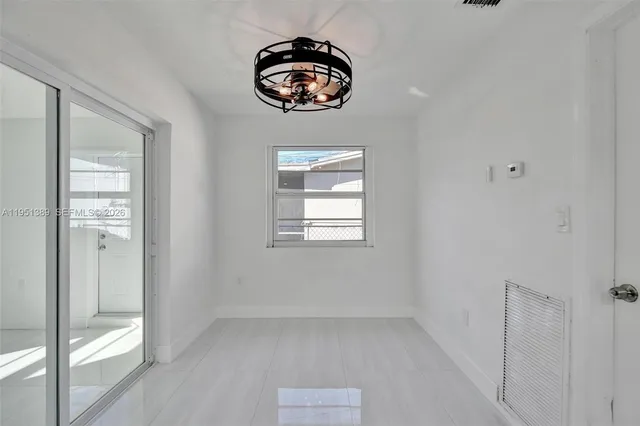 an empty room that has a window