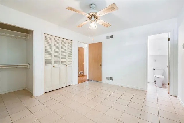 a view of an empty room with a bathroom