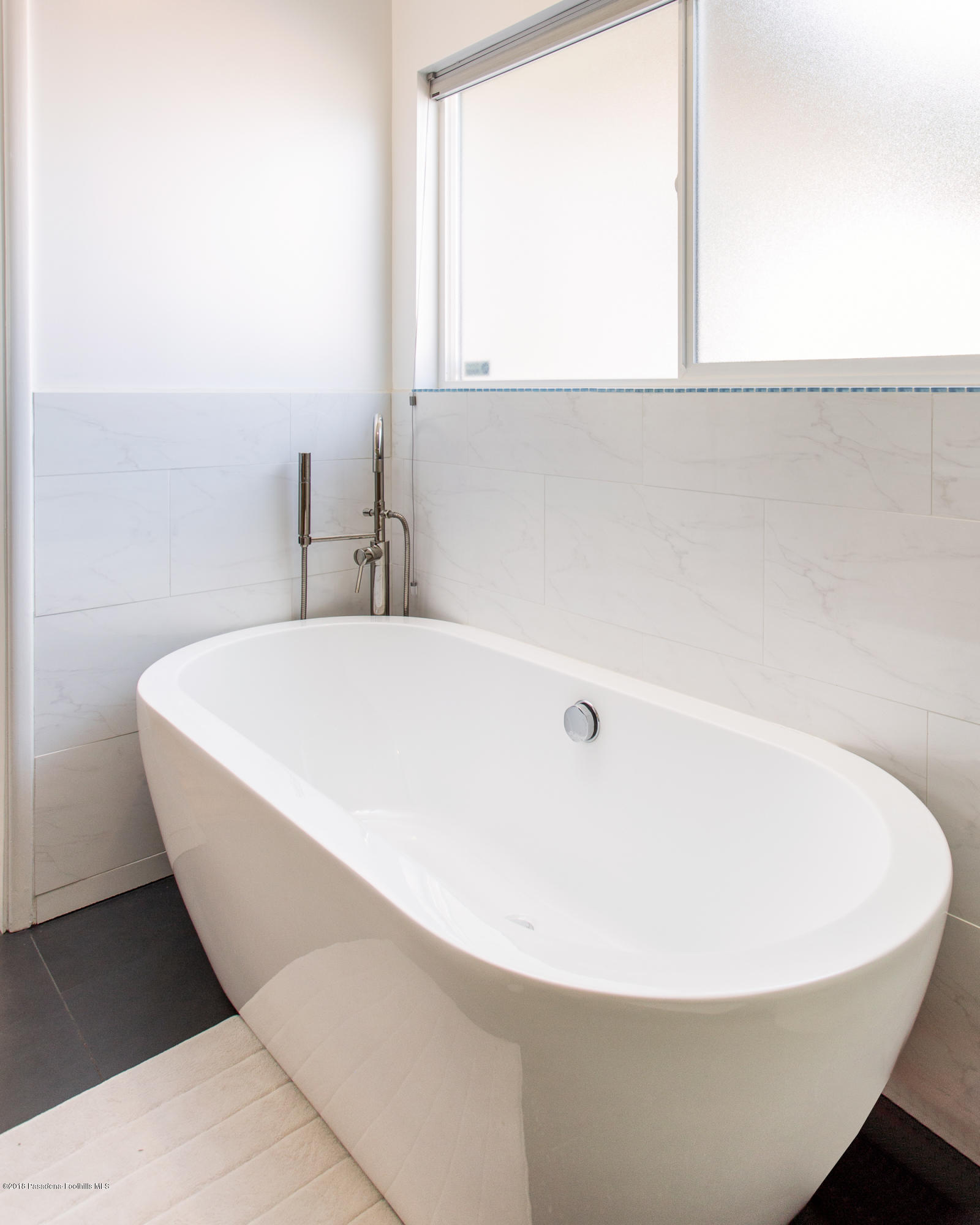 3610 Hampton Road Pasadena, CA 91107 - Photo 12 of 27 a white bath tub sitting in a bathroom