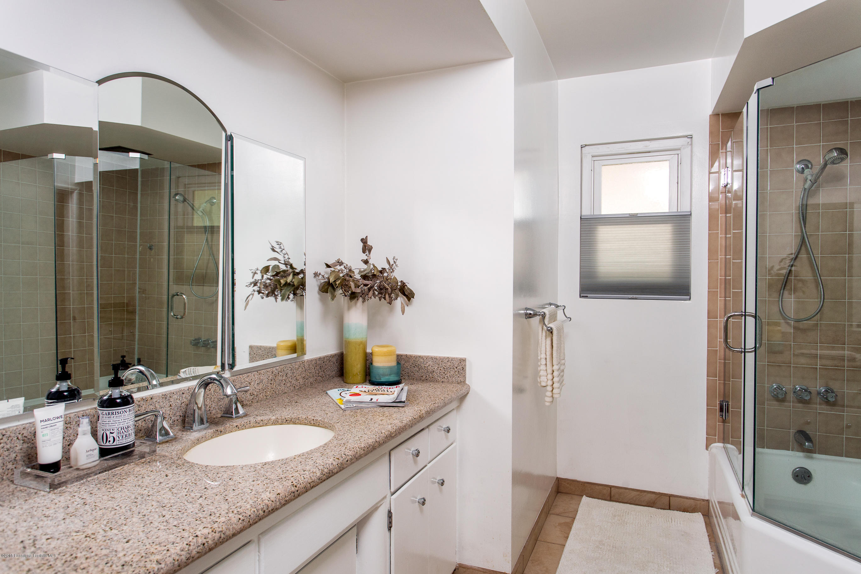 3610 Hampton Road Pasadena, CA 91107 - Photo 15 of 27 a bathroom with a granite countertop sink and a mirror