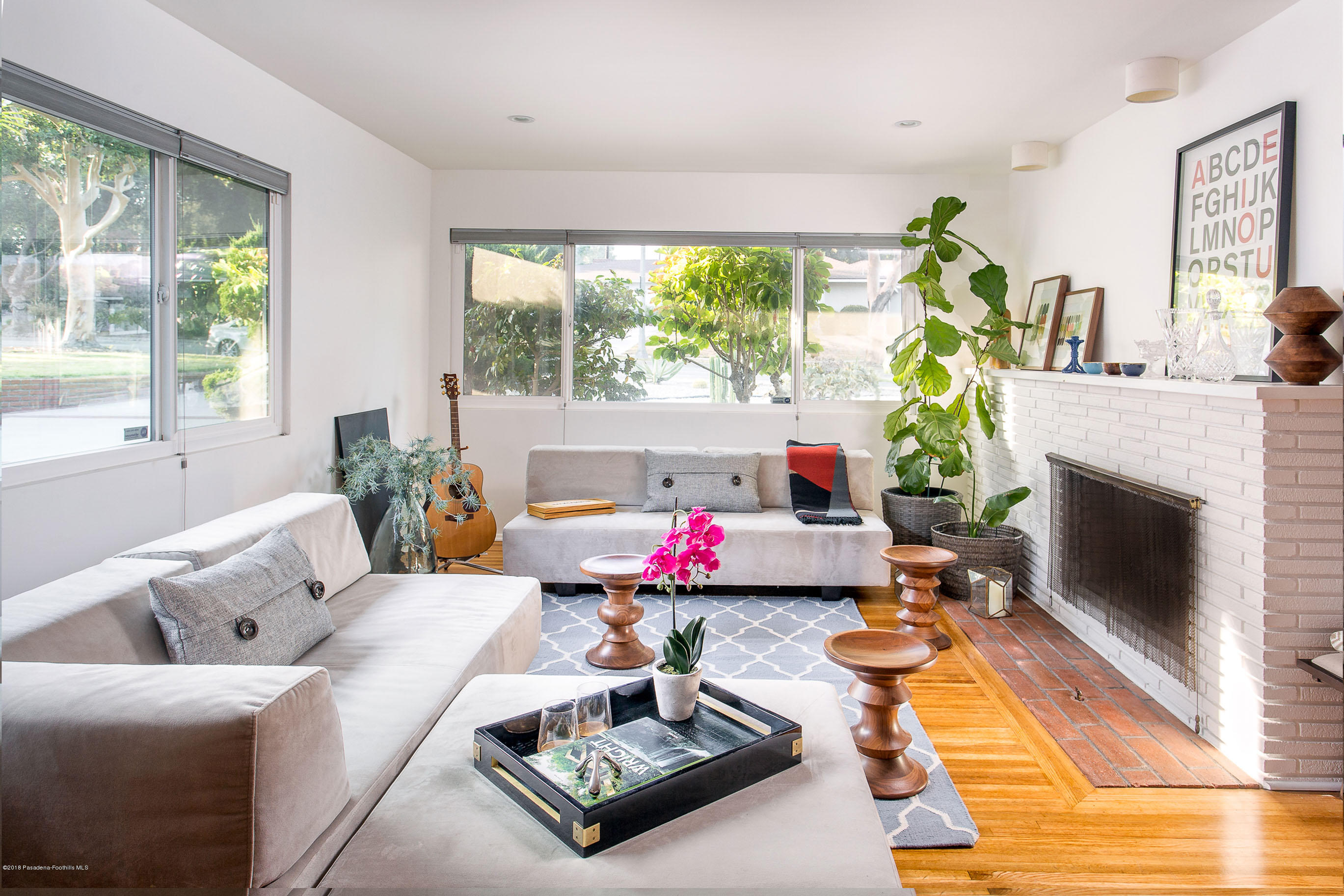 3610 Hampton Road Pasadena, CA 91107 - Photo 2 of 27 a living room with furniture and a fireplace