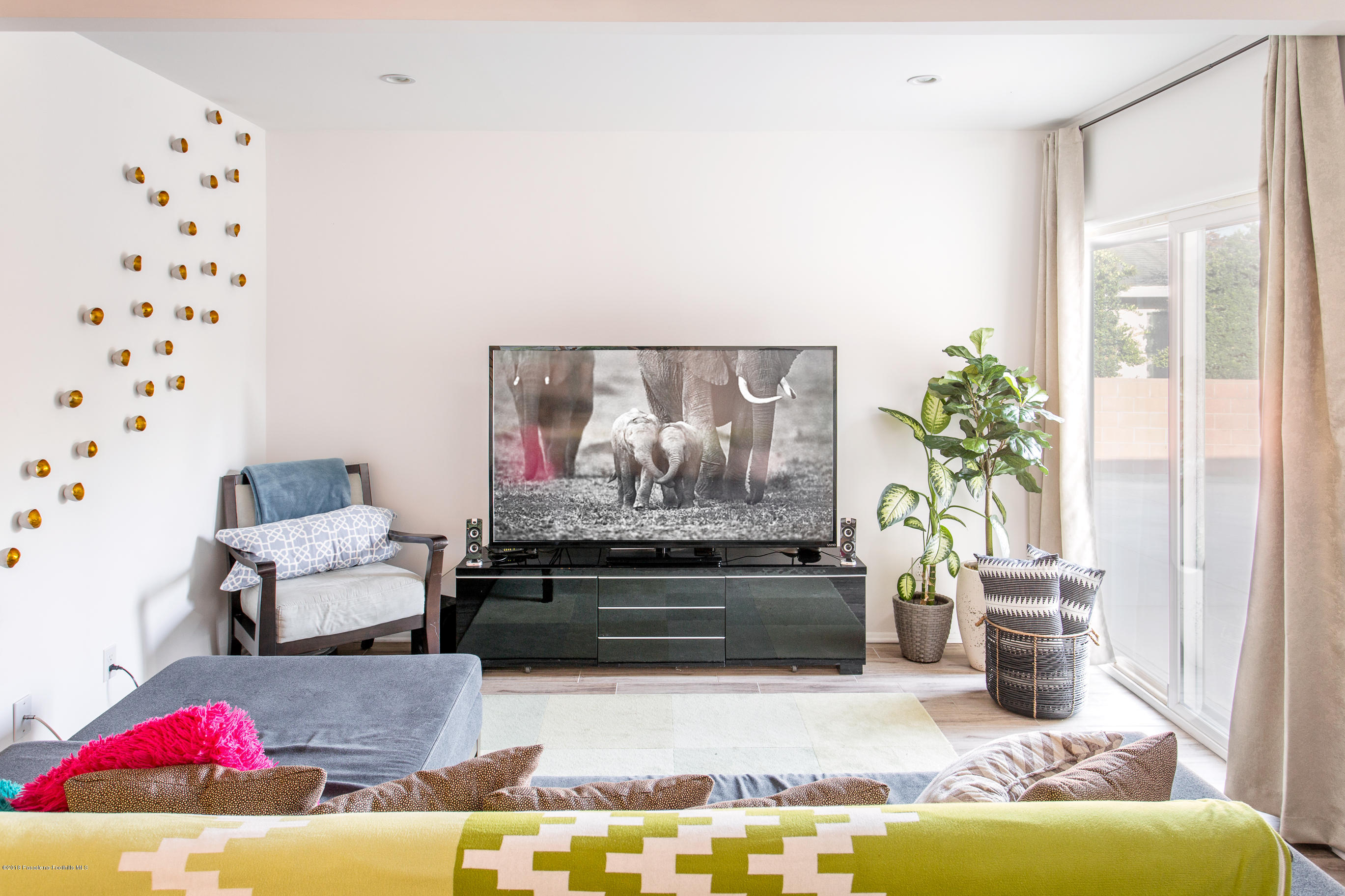 3610 Hampton Road Pasadena, CA 91107 - Photo 3 of 27 a living room with furniture and flowers