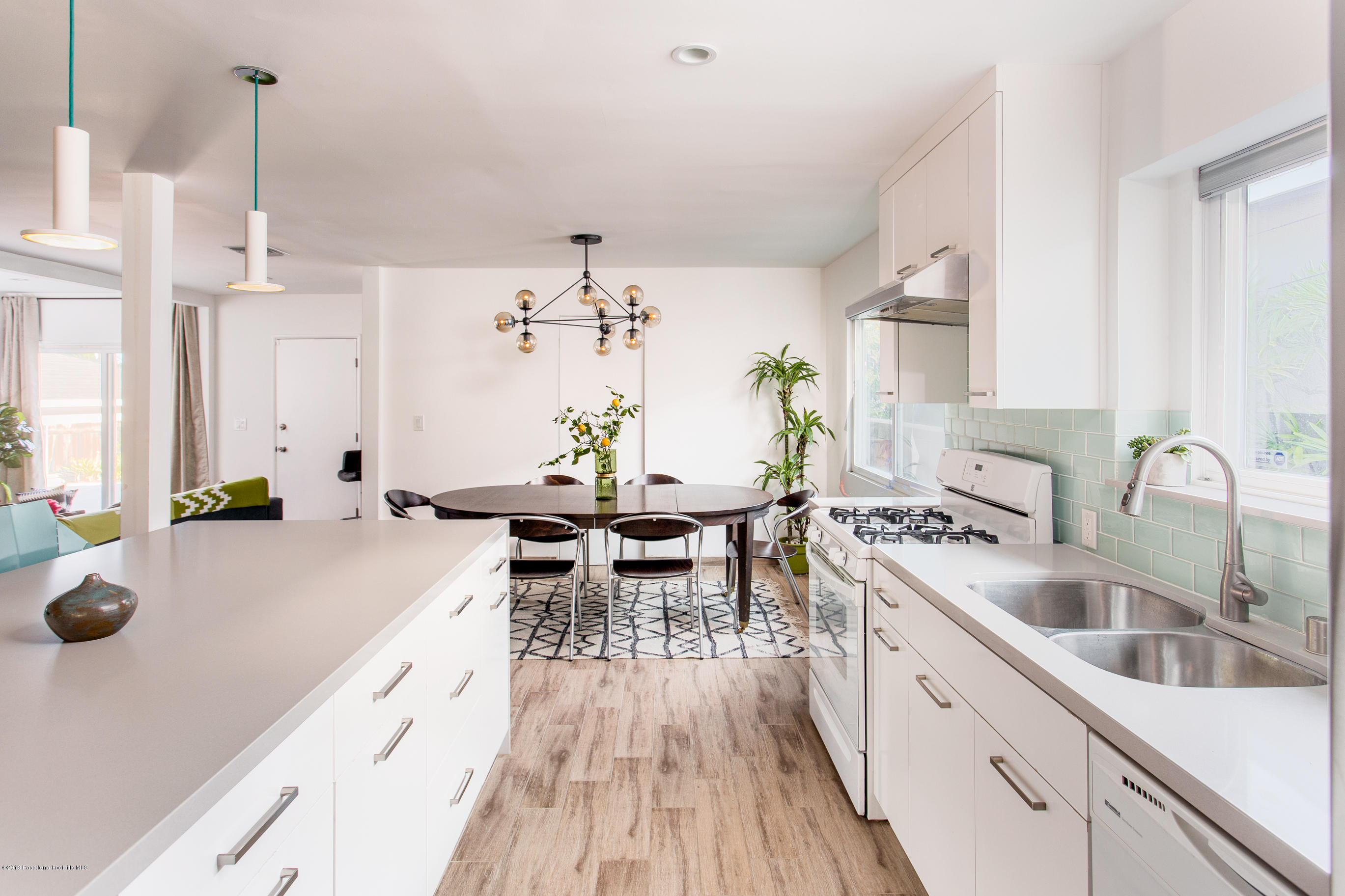 3610 Hampton Road Pasadena, CA 91107 - Photo 5 of 27 a kitchen with sink a counter and chairs