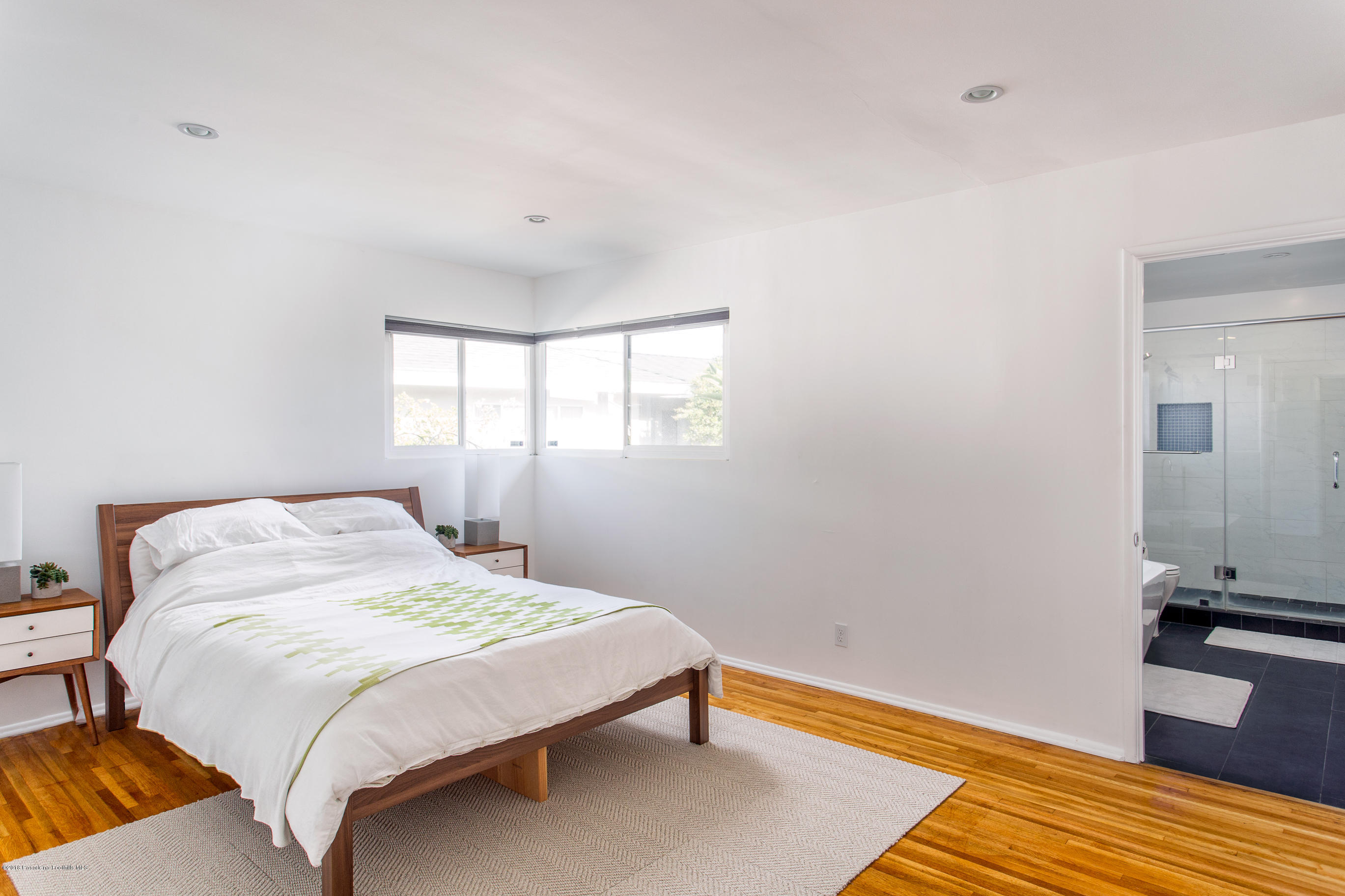 3610 Hampton Road Pasadena, CA 91107 - Photo 9 of 27 a bedroom with a bed and wooden floor