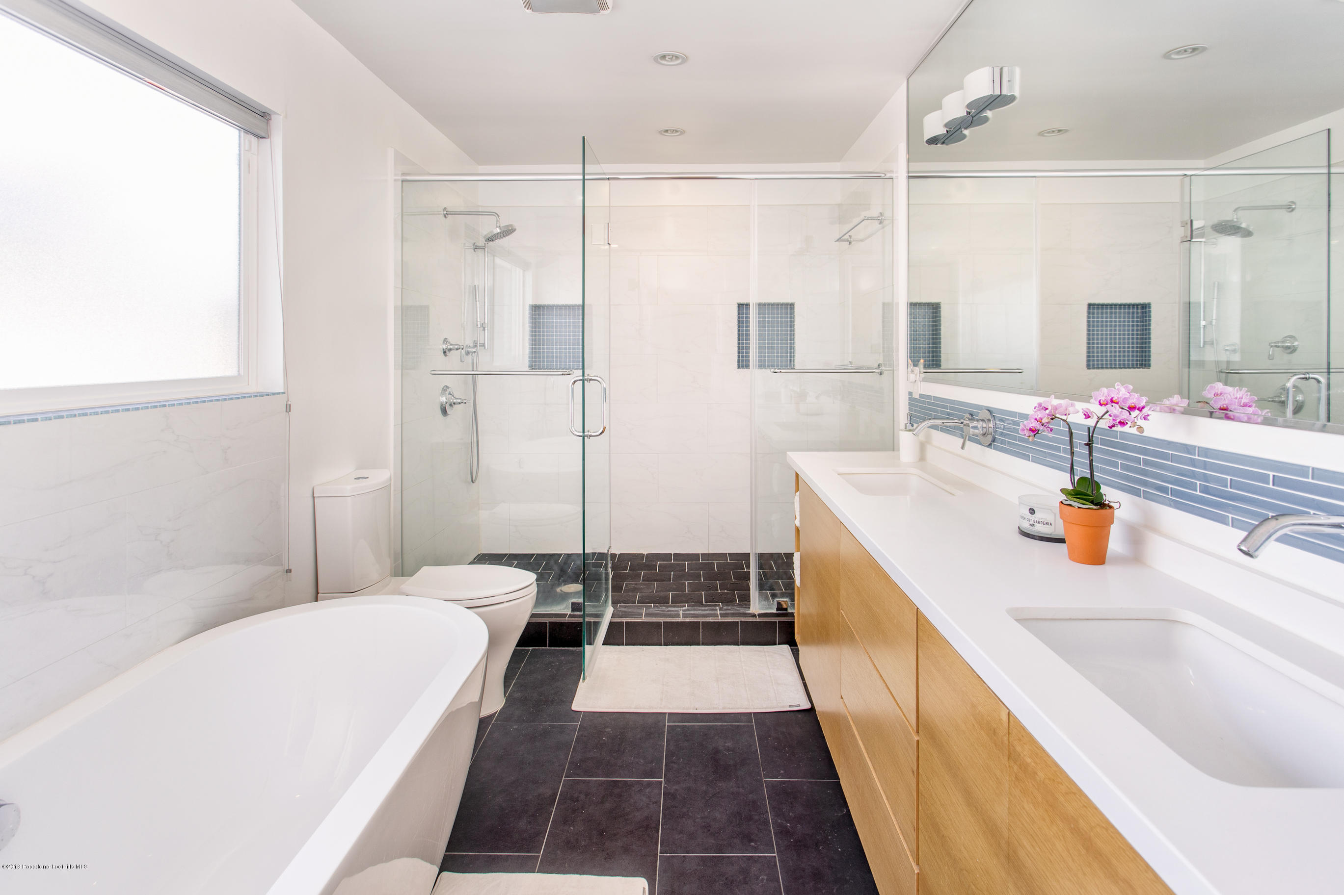 3610 Hampton Road Pasadena, CA 91107 - Photo 10 of 27 a bathroom with a tub sink and shower