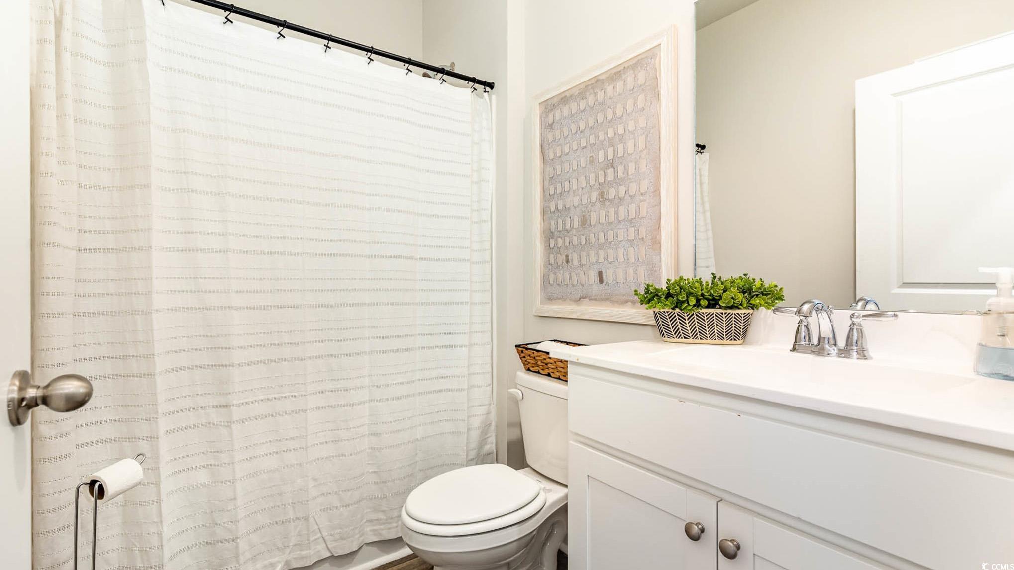 109 Homestead Way Myrtle Beach, SC 29588 - Photo 20 of 22 Bathroom with vanity and a shower with curtain