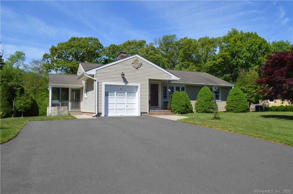 86 Suffield Street Windsor Locks, CT 06096 - Photo 1 of 1 a front view of a house with a yard and garage