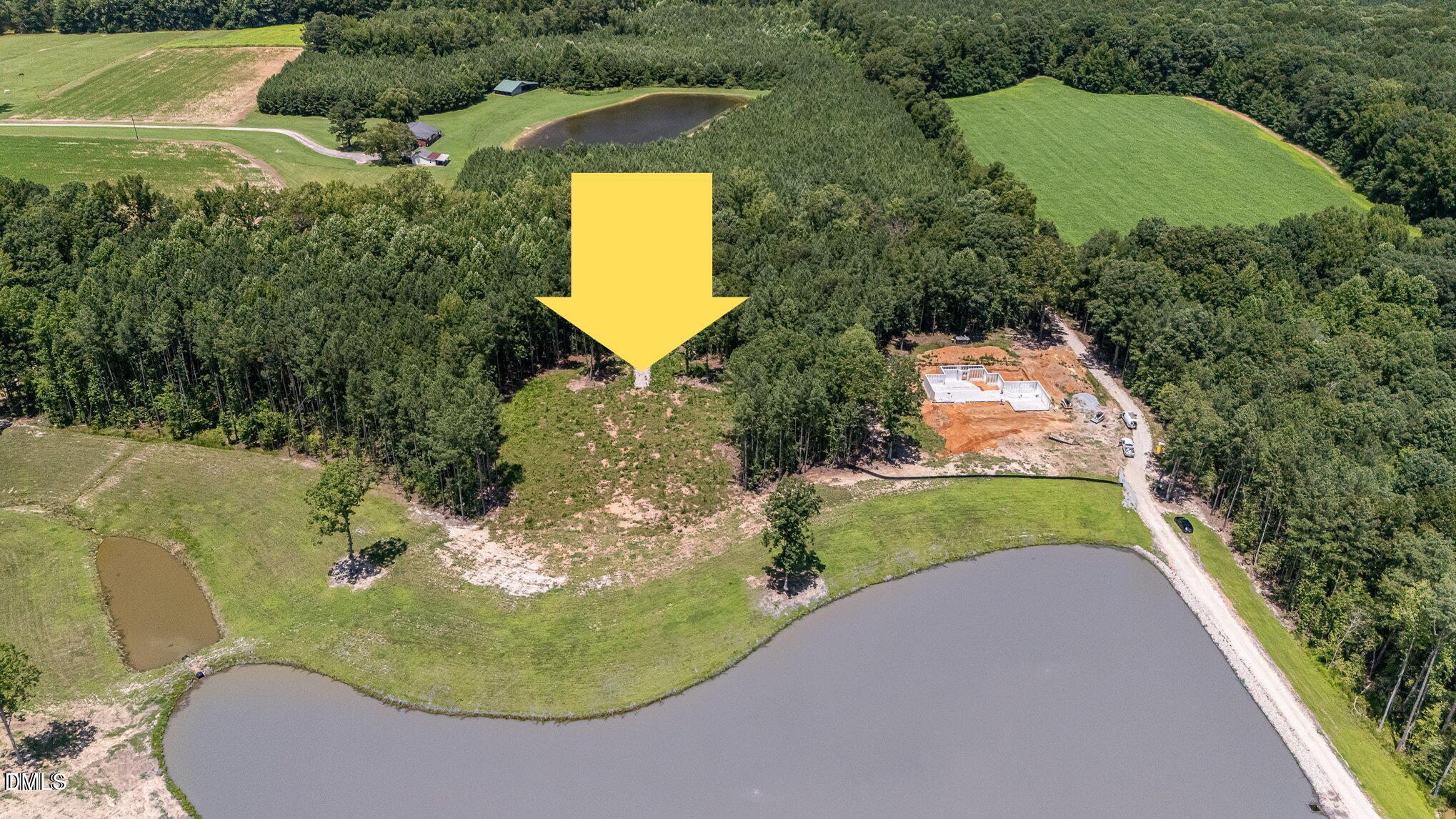 230 Bealy Farm Road Zebulon, NC 27597 - Photo 12 of 12 an aerial view of a house with a yard and lake view