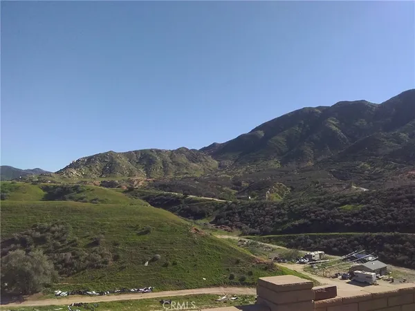 a view of a town with mountains in the background