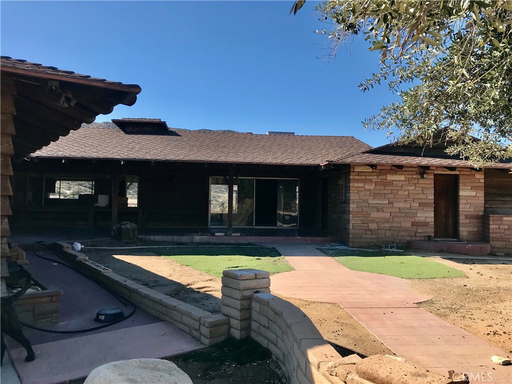 7840 Reche Canyon Road Colton, CA 92324 - Photo 2 of 20 a view of a house with swimming pool in front of it