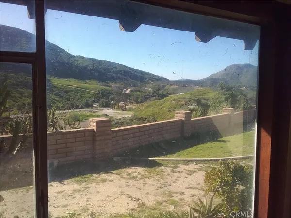 a view of a small yard from a balcony