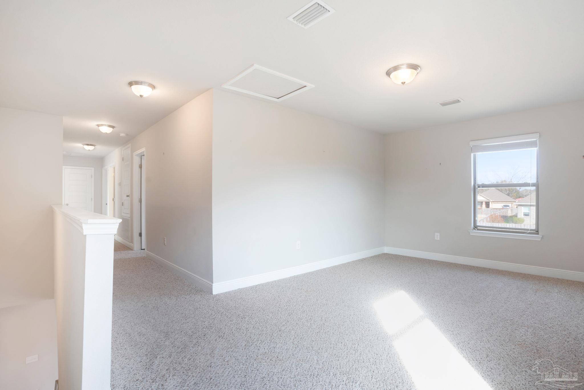 8016 Woodbrook Road Pensacola, FL 32526 - Photo 8 of 52 a view of an empty room with a window