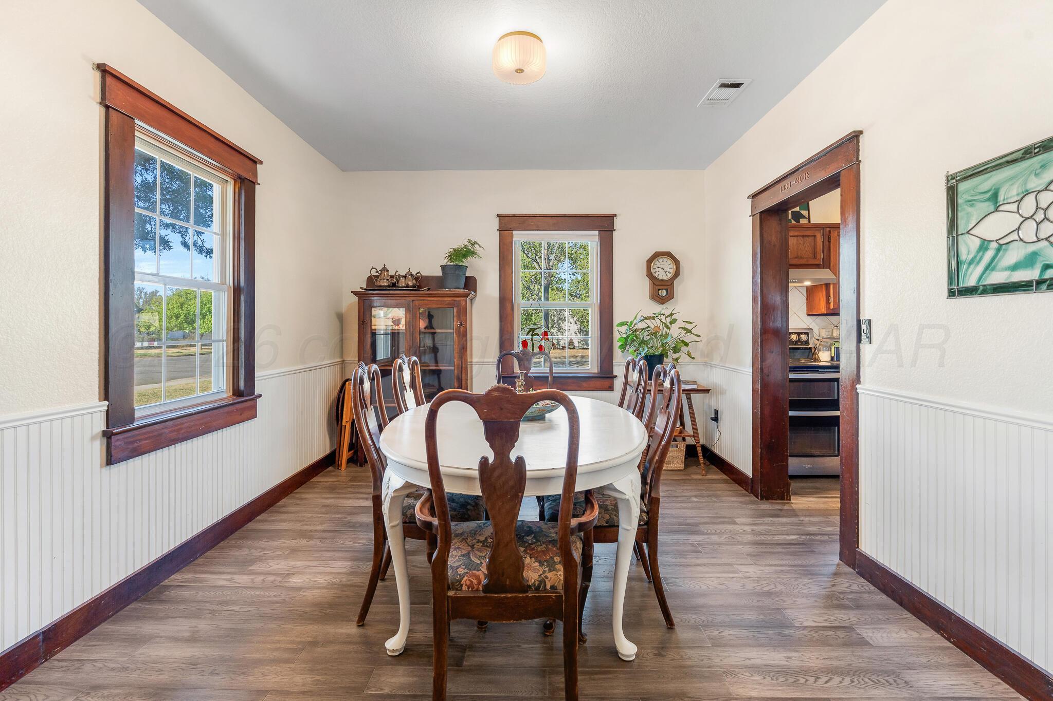 1401 3rd Avenue Canyon, TX 79015 - Photo 15 of 40 a view of a dining room with furniture window and wooden floor