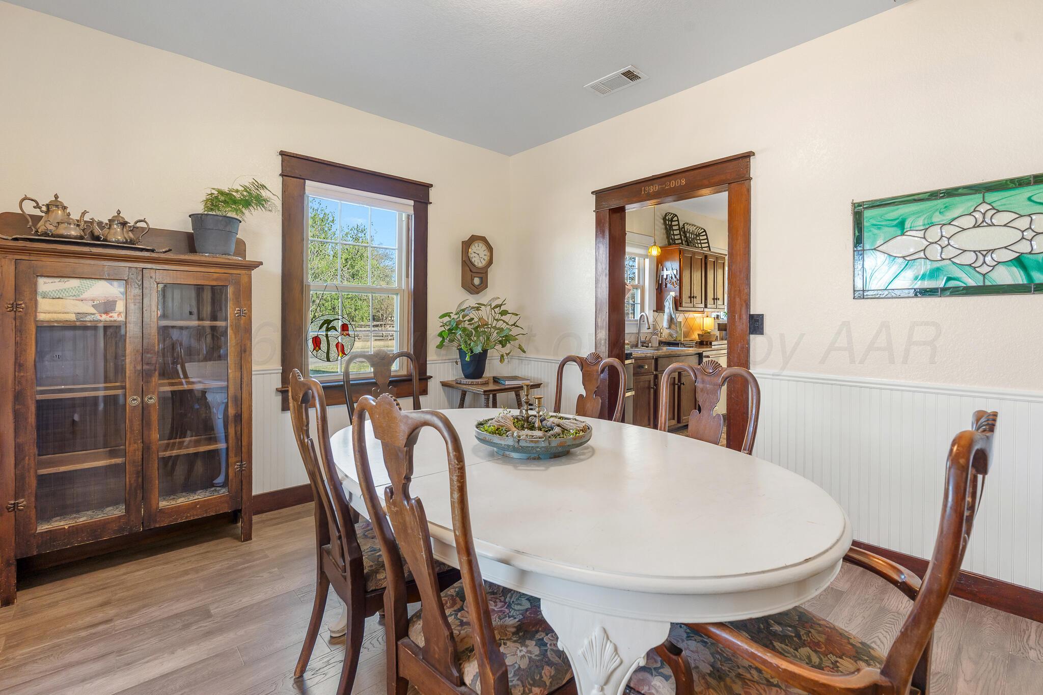 1401 3rd Avenue Canyon, TX 79015 - Photo 16 of 40 a view of a dining room with furniture window and wooden floor