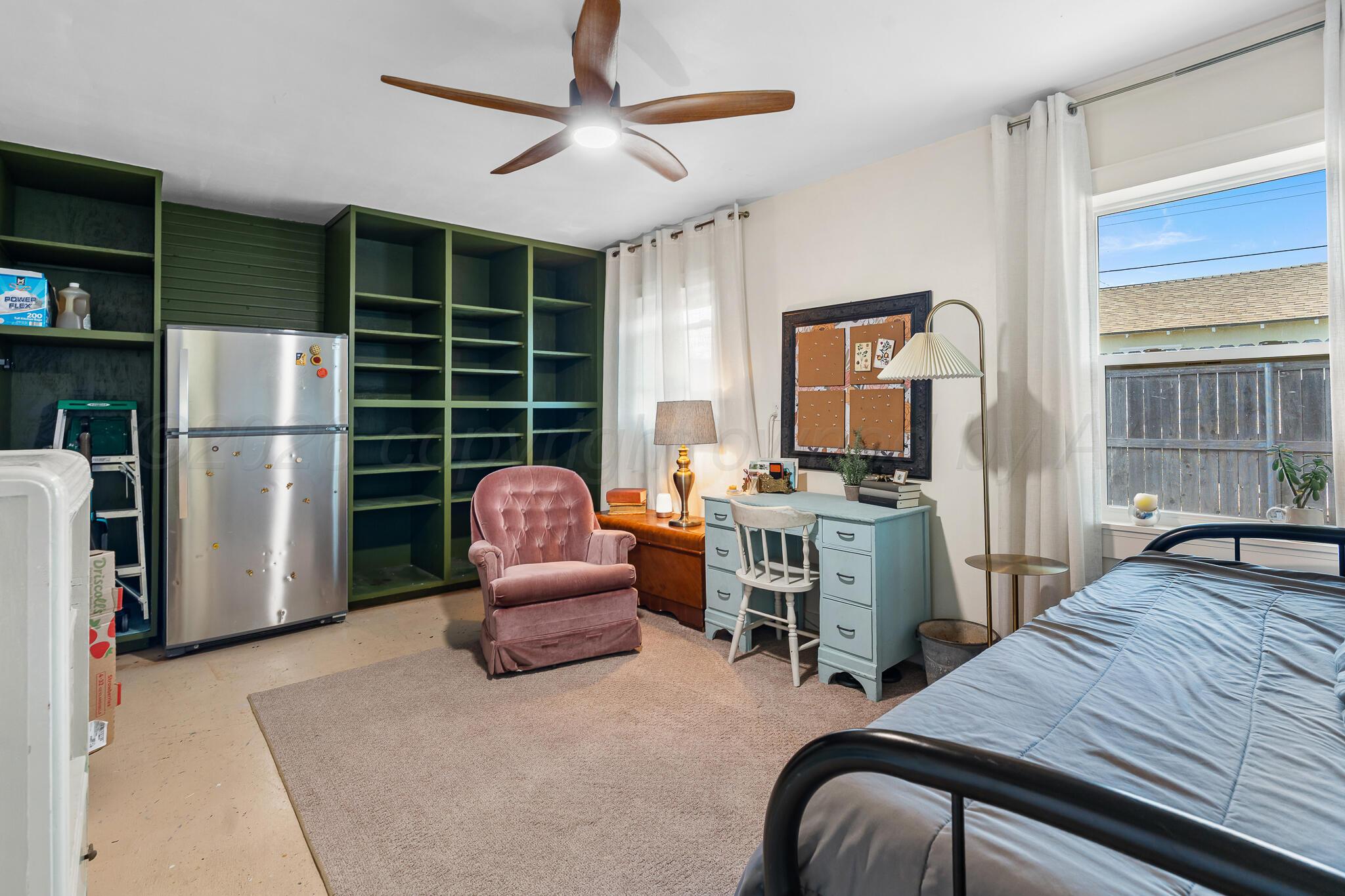 1401 3rd Avenue Canyon, TX 79015 - Photo 23 of 40 a bedroom with furniture and a window