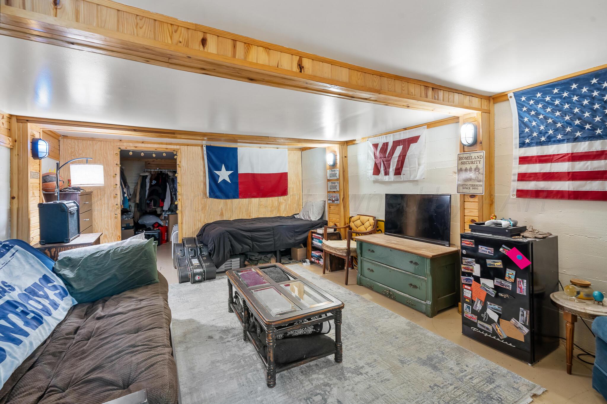 1401 3rd Avenue Canyon, TX 79015 - Photo 28 of 40 a living room with furniture and a flat screen tv