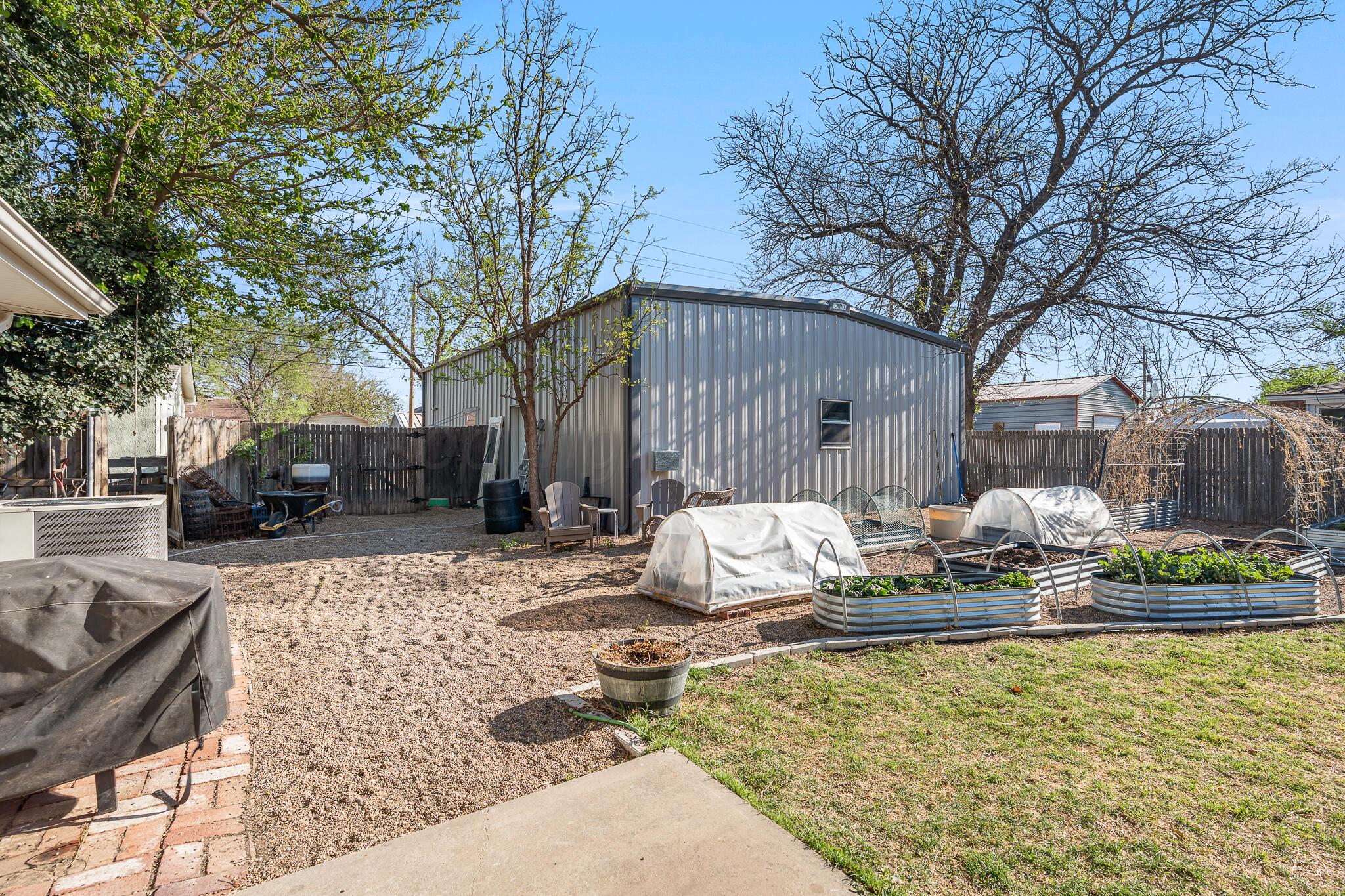 1401 3rd Avenue Canyon, TX 79015 - Photo 30 of 40 a wooden bench sitting in front of a house