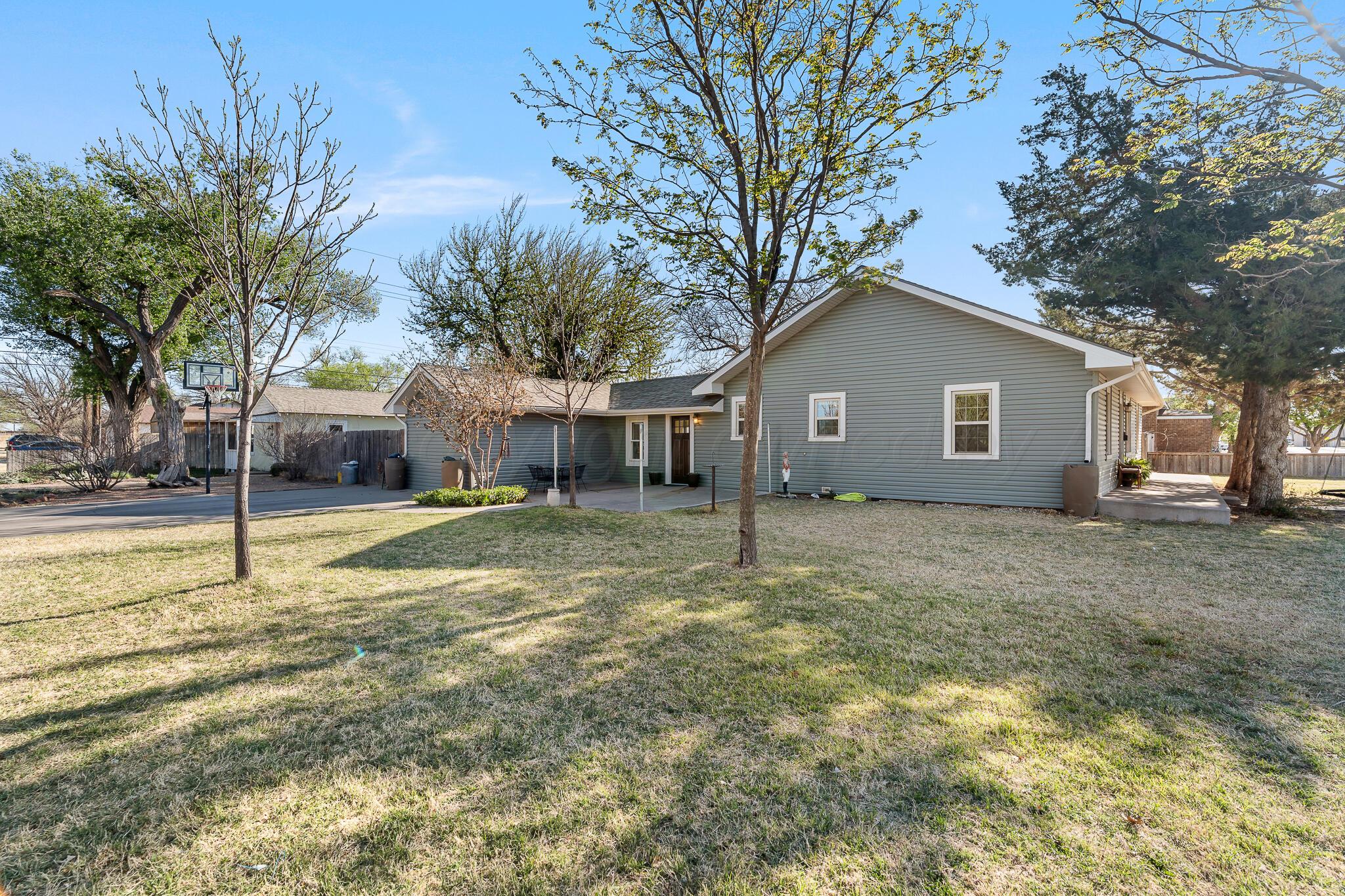 1401 3rd Avenue Canyon, TX 79015 - Photo 3 of 40 a view of a house with a yard and large tree