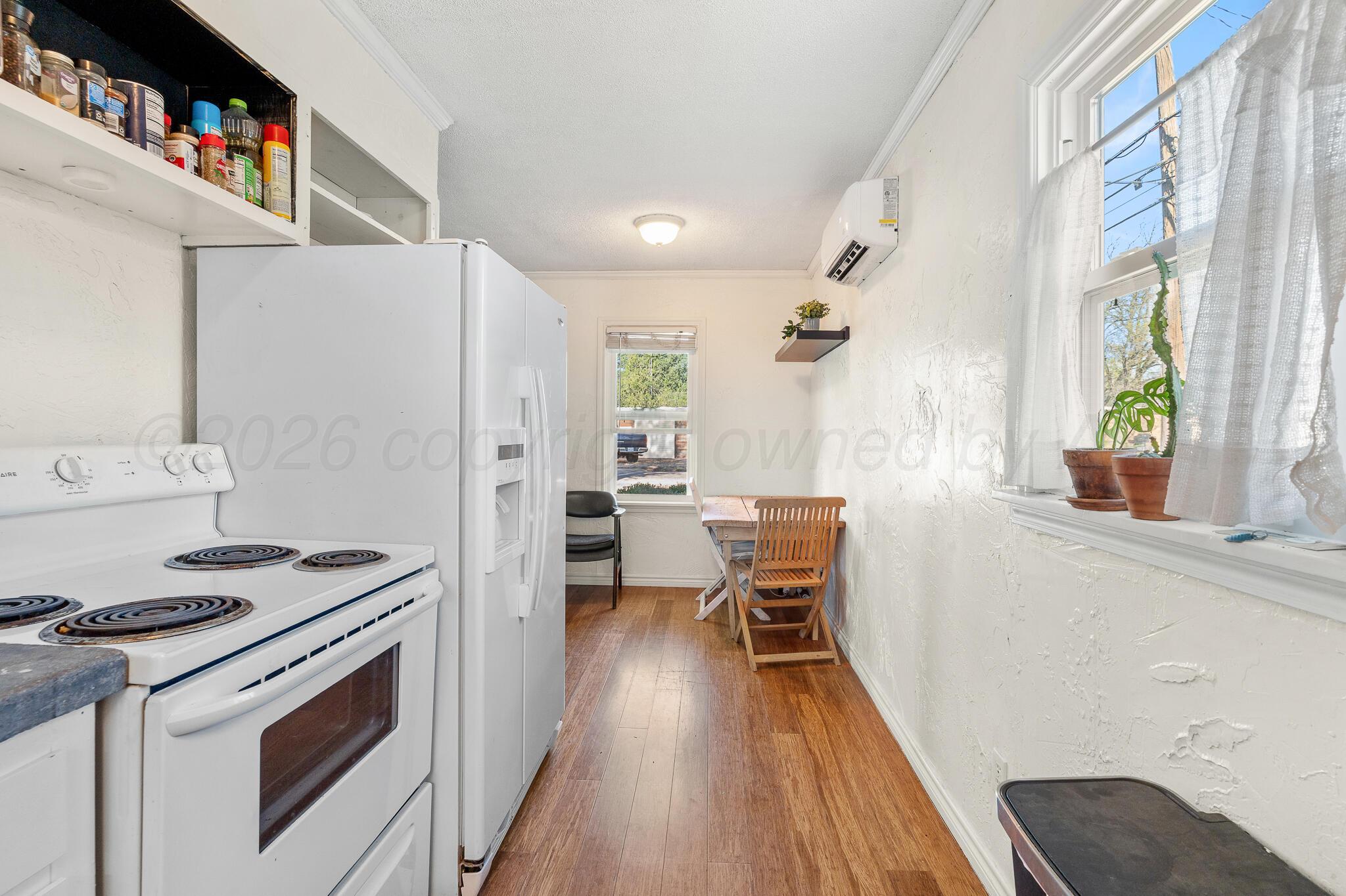 1401 3rd Avenue Canyon, TX 79015 - Photo 38 of 40 a kitchen with stainless steel appliances a stove a sink and a refrigerator