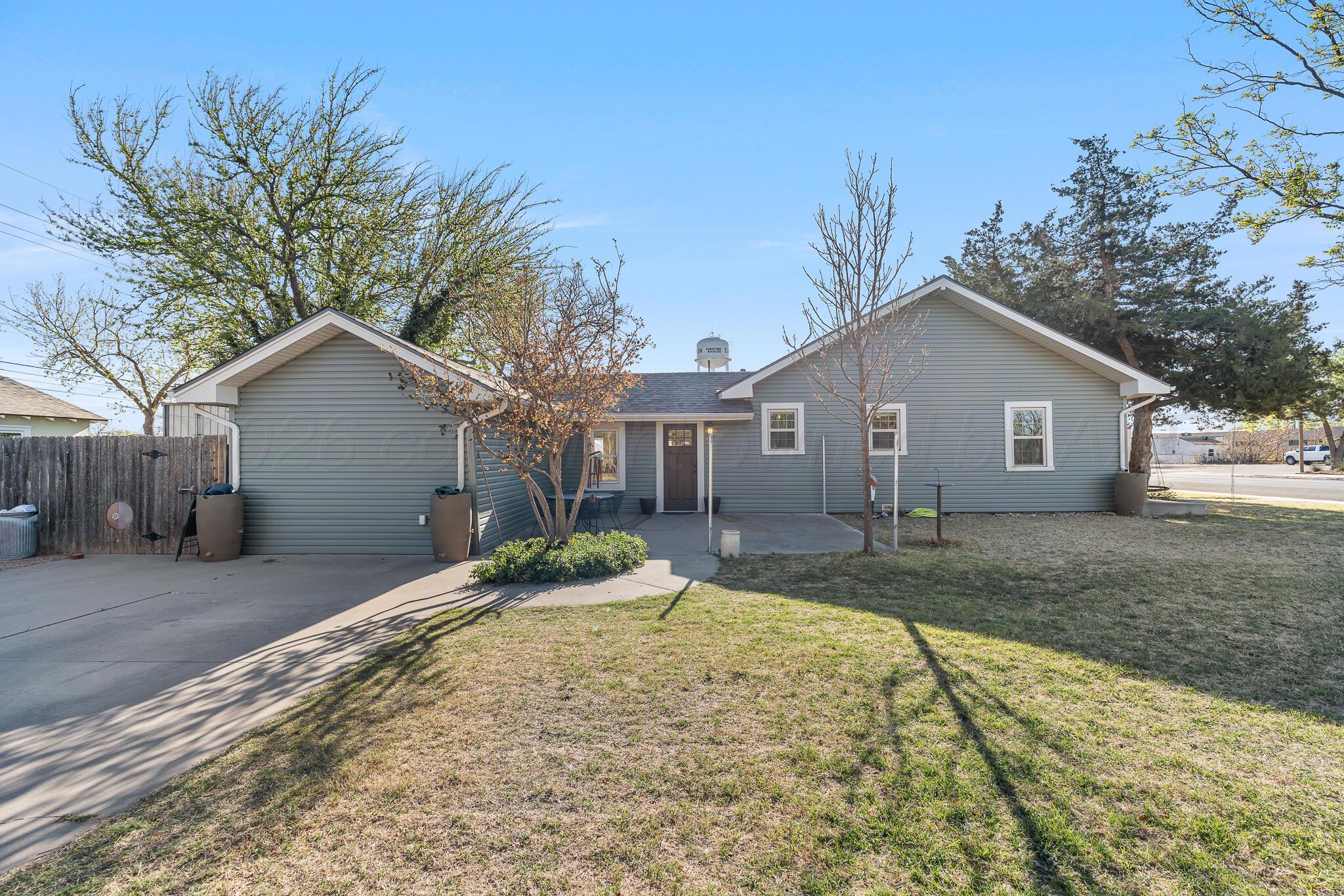 1401 3rd Avenue Canyon, TX 79015 - Photo 4 of 40 a view of a house with a yard covered in snow