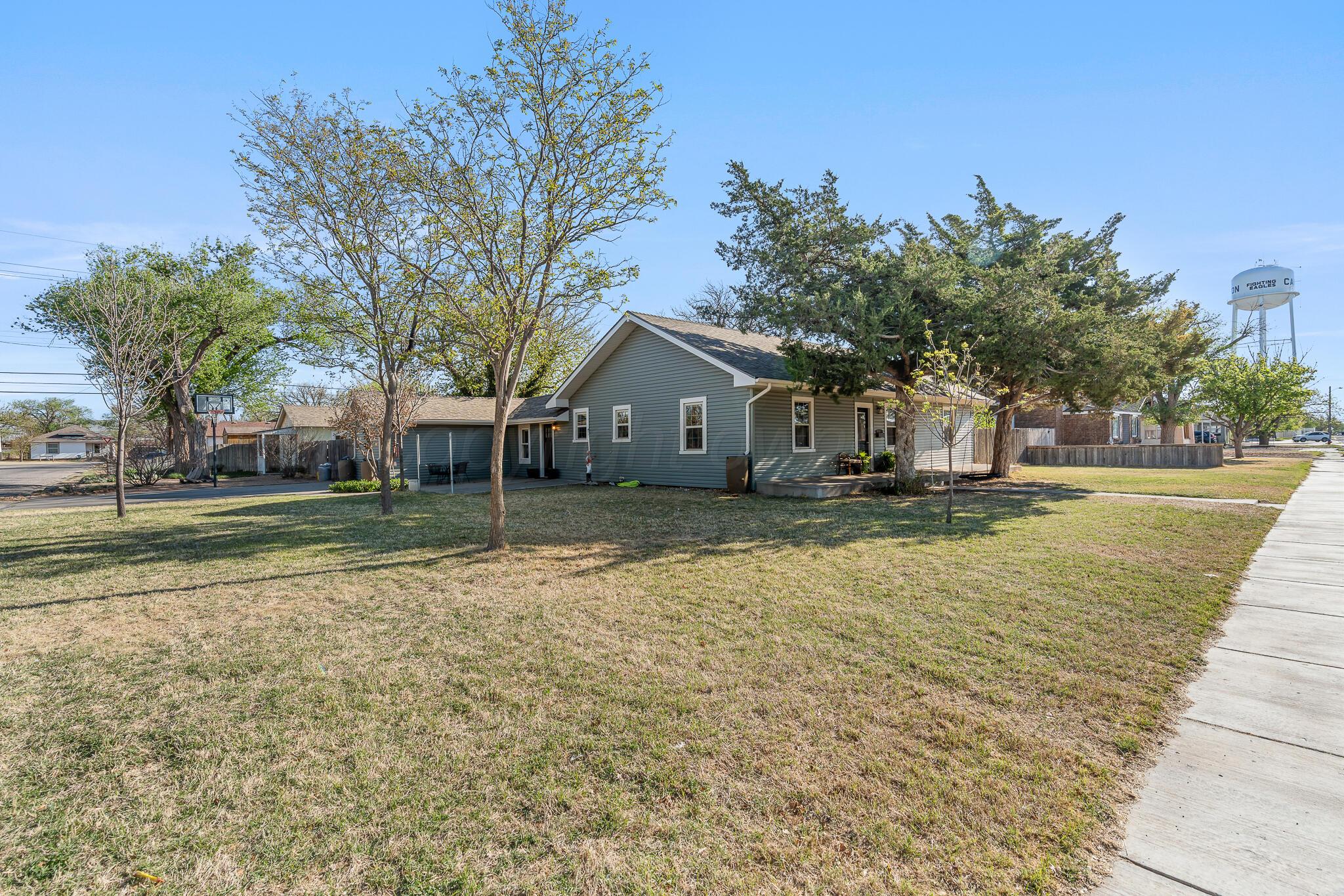 1401 3rd Avenue Canyon, TX 79015 - Photo 5 of 40 a house with trees in front of it