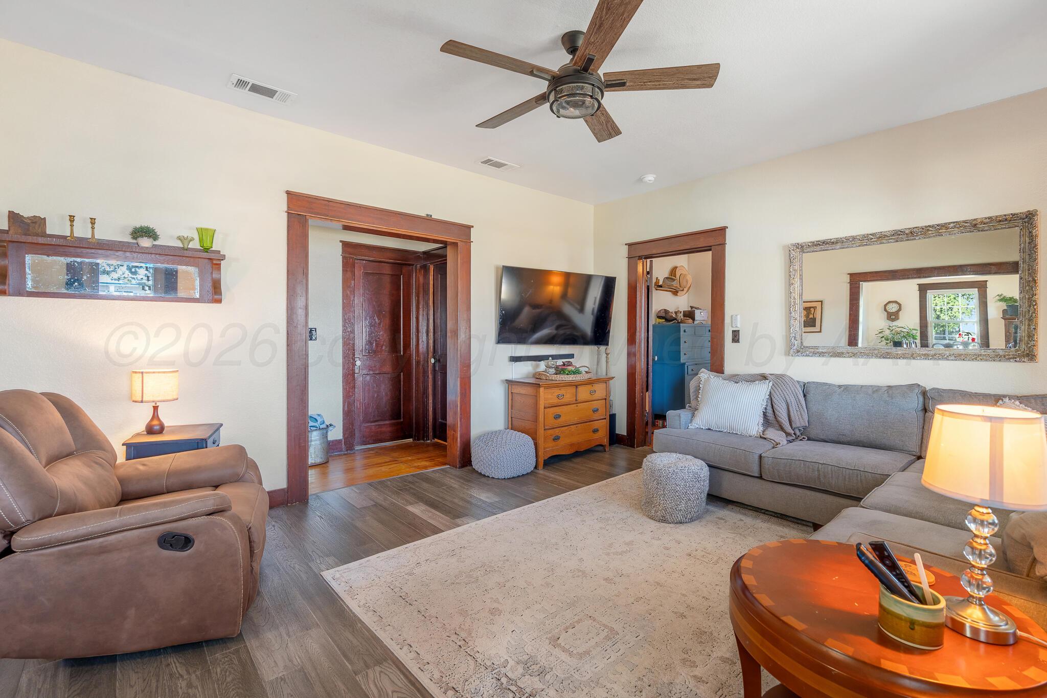 1401 3rd Avenue Canyon, TX 79015 - Photo 7 of 40 a living room with furniture and a flat screen tv