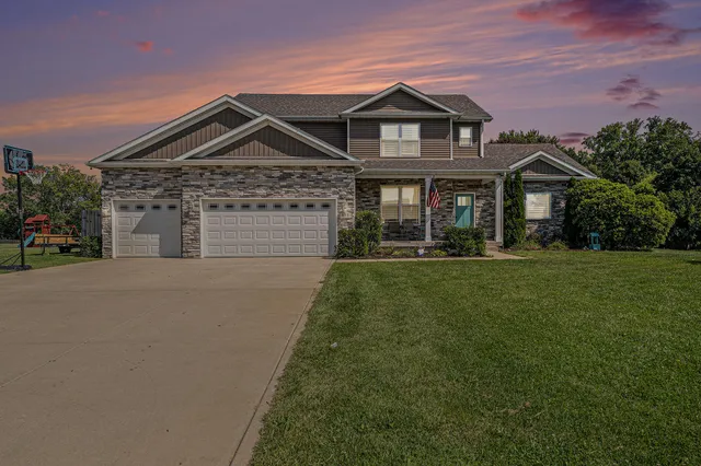 a front view of a house with a yard