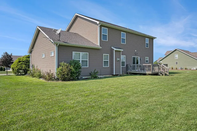 a front view of house with a garden