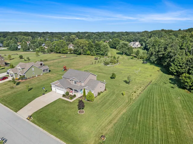 an aerial view of a house with a garden