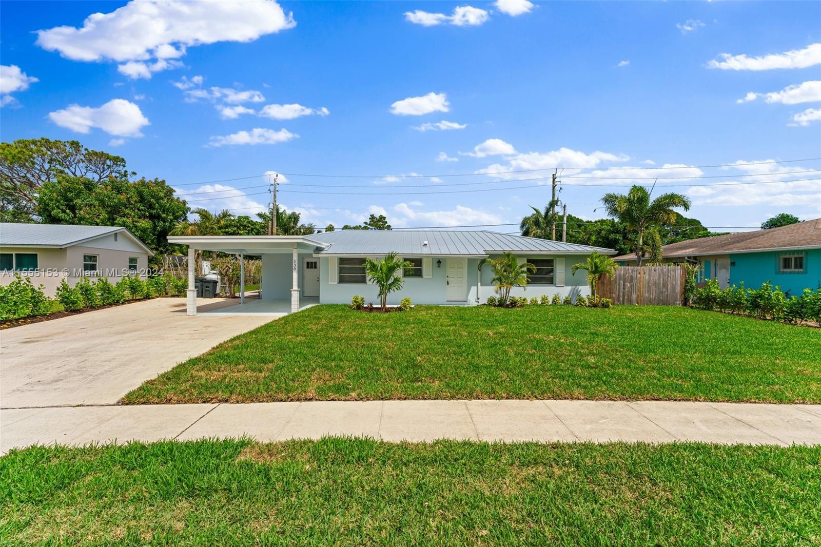 538 Dover Road Tequesta, FL 33469 - Photo 3 of 63 a view of house with outdoor space and yard