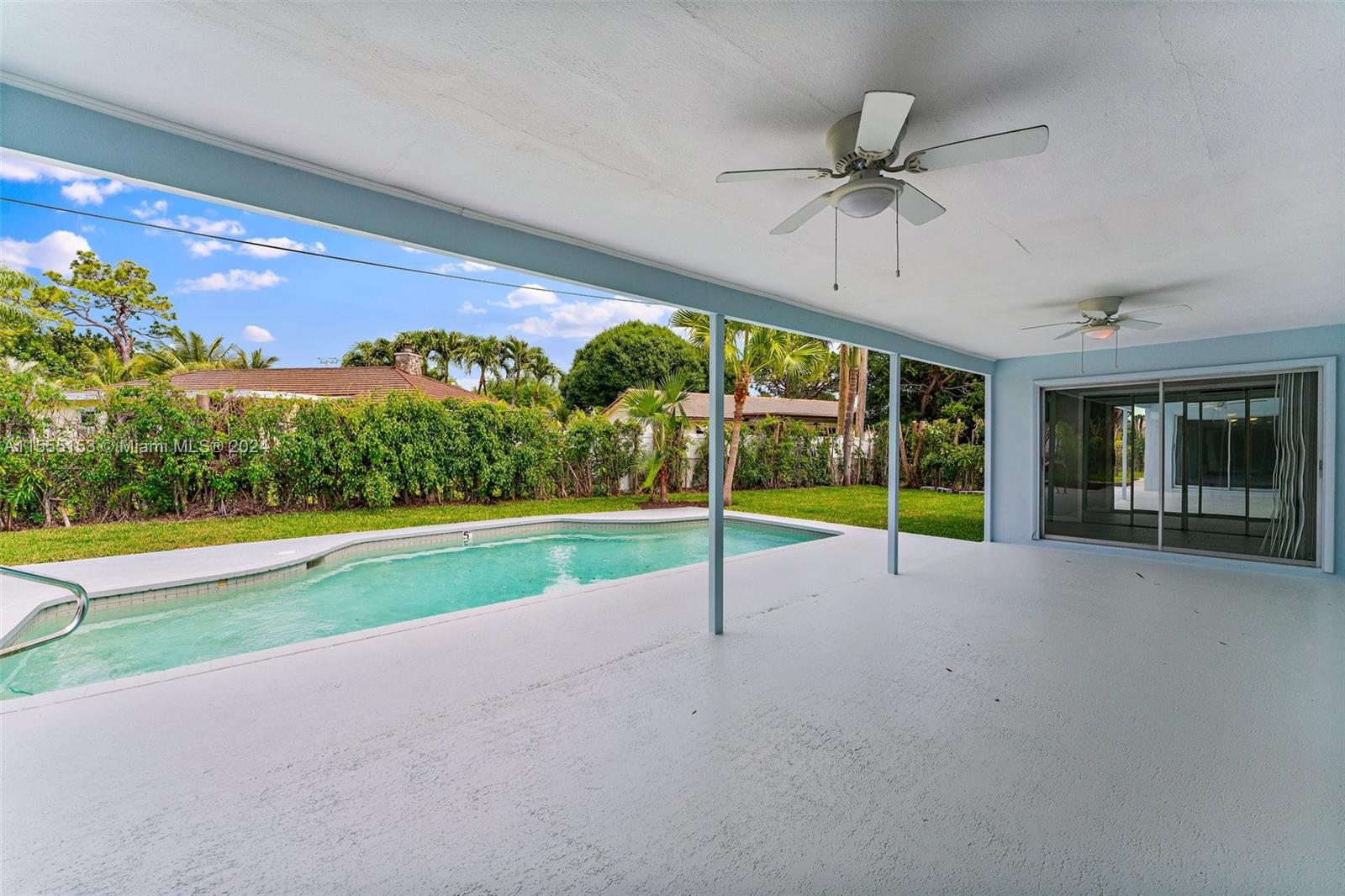 538 Dover Road Tequesta, FL 33469 - Photo 38 of 63 a view of an empty room with a swimming pool