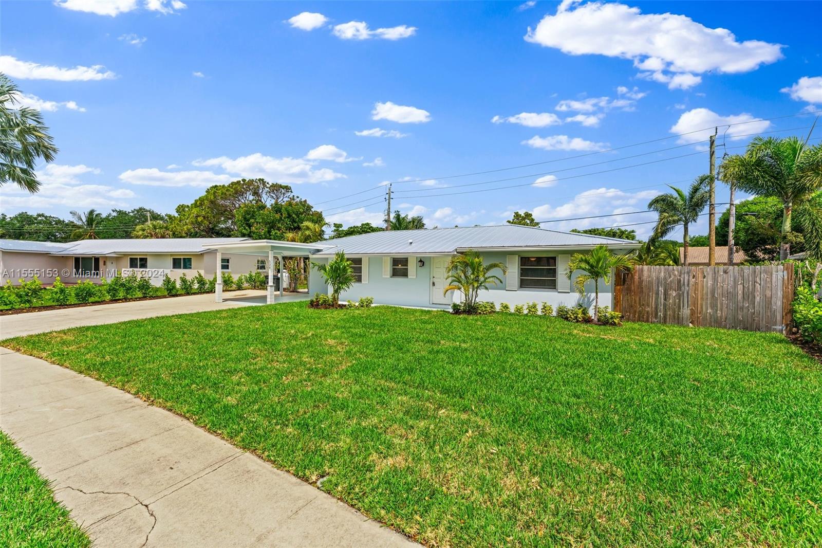 538 Dover Road Tequesta, FL 33469 - Photo 4 of 63 a view of a house with a yard