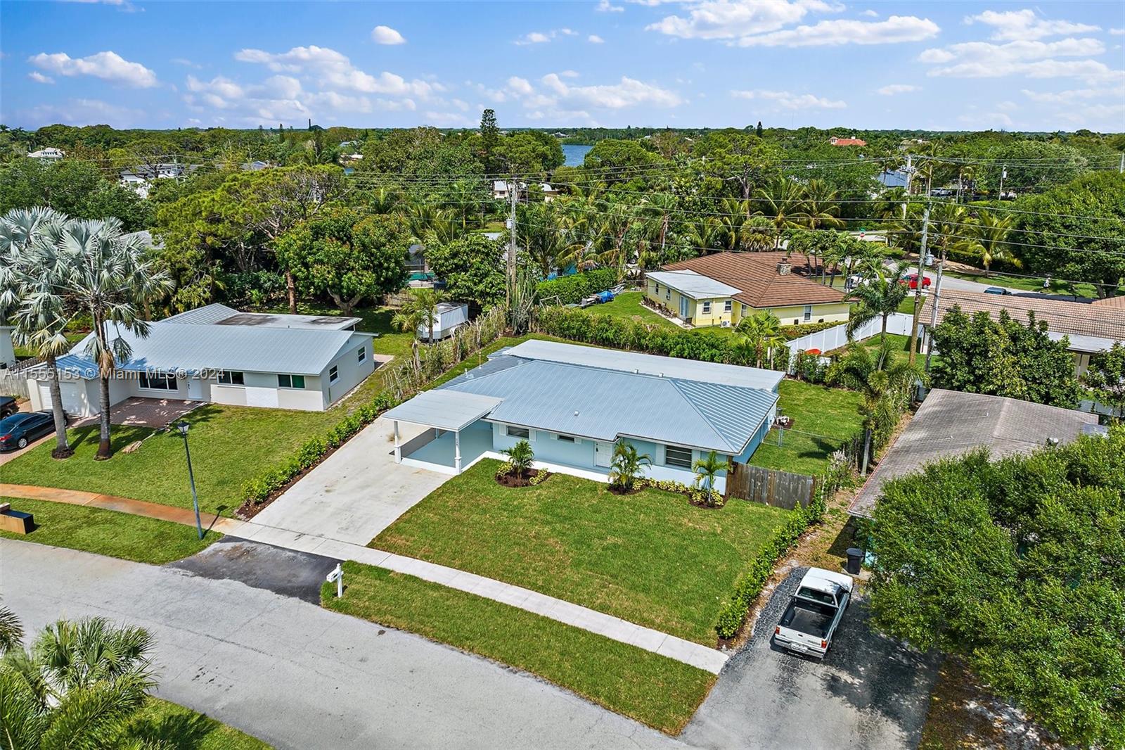 538 Dover Road Tequesta, FL 33469 - Photo 46 of 63 an aerial view of a house with a garden