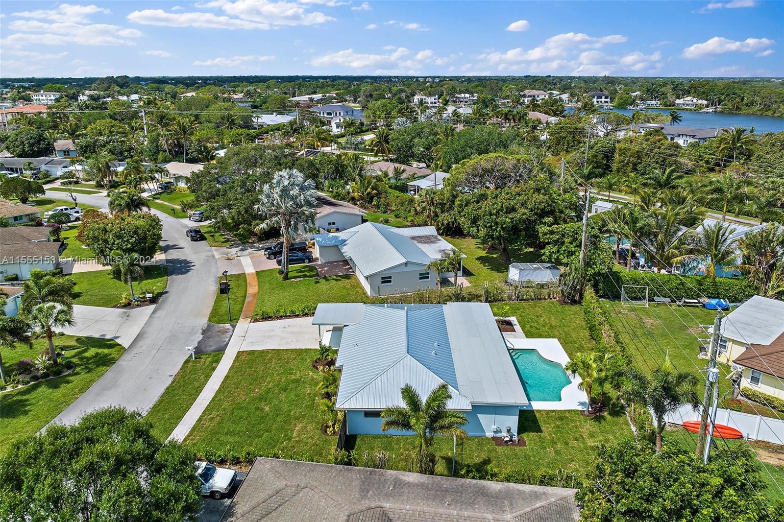 538 Dover Road Tequesta, FL 33469 - Photo 48 of 63 an aerial view of residential houses with outdoor space and trees