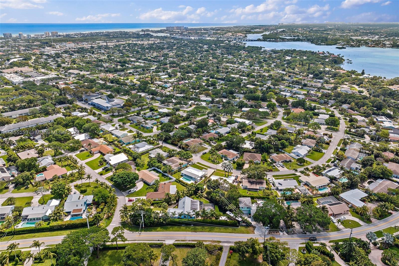 538 Dover Road Tequesta, FL 33469 - Photo 60 of 63 an aerial view of residential houses with outdoor space and trees
