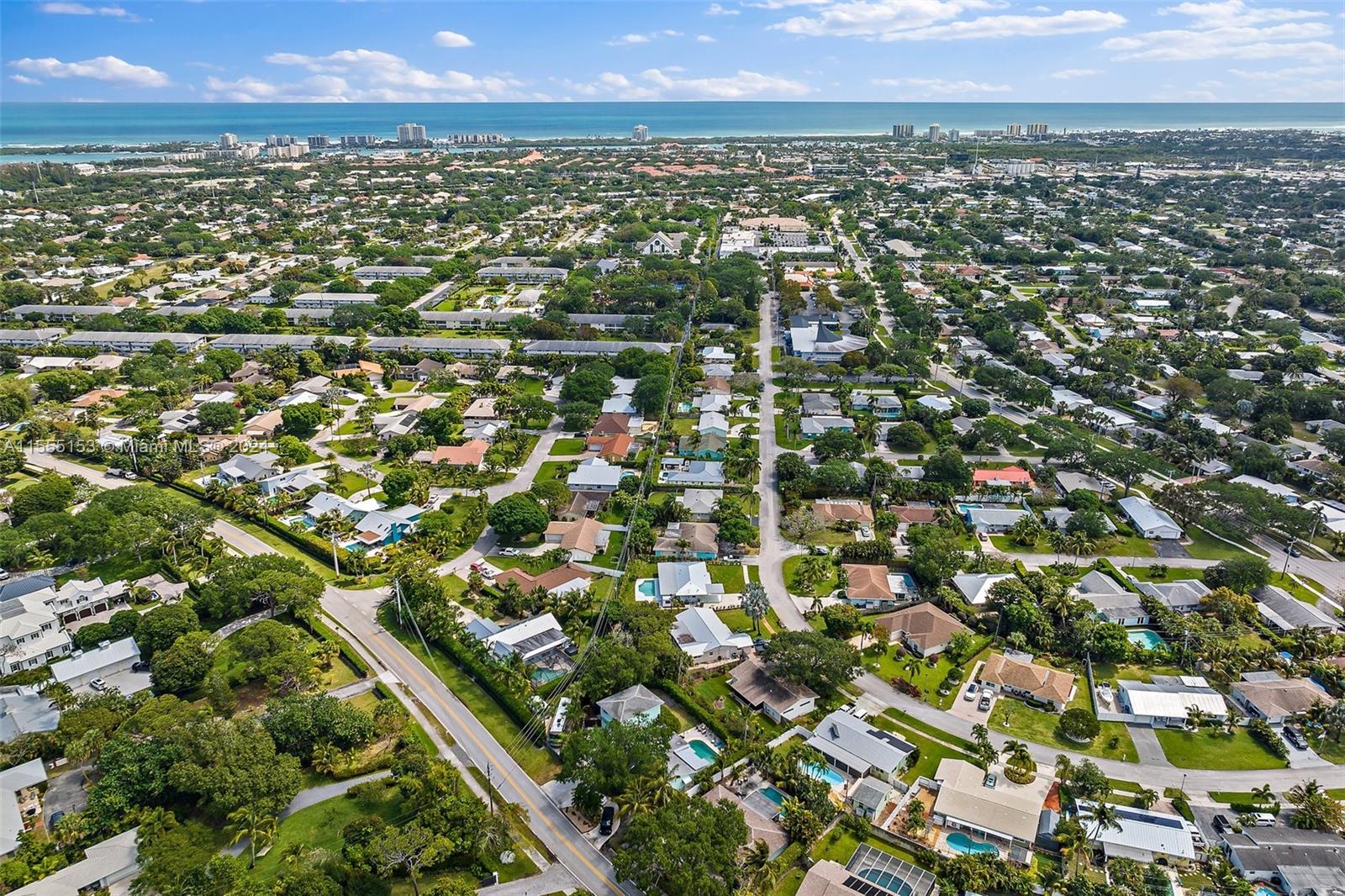 538 Dover Road Tequesta, FL 33469 - Photo 61 of 63 an aerial view of residential houses with outdoor space and trees